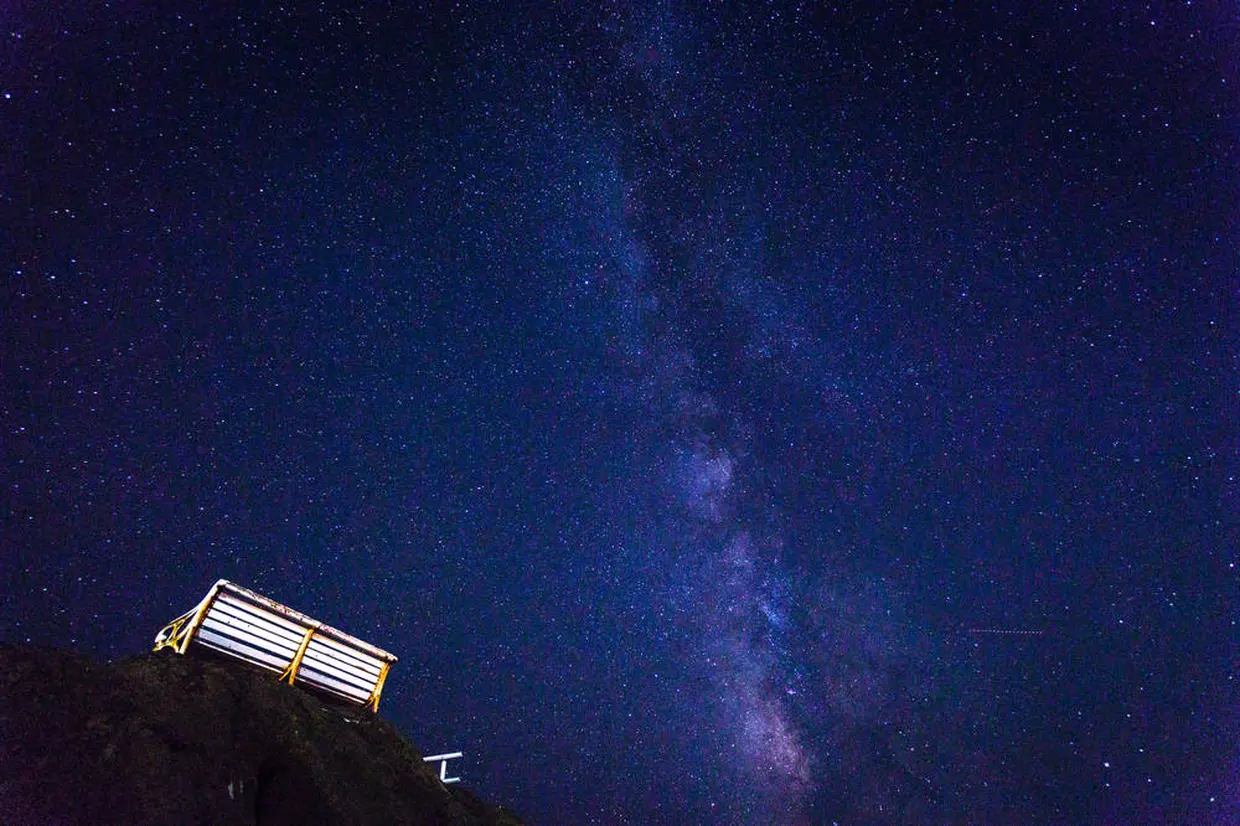 Starry sky and white bench at Nojimazaki