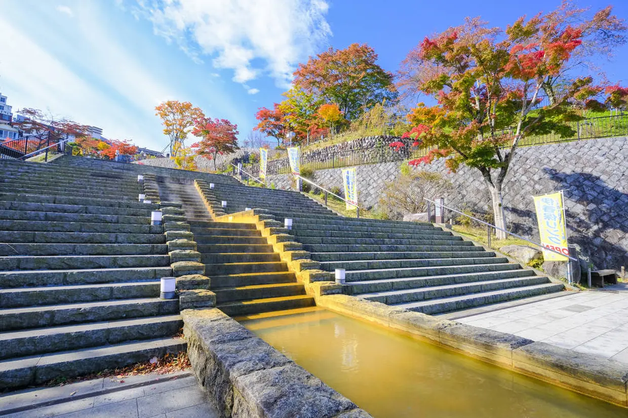 Golden hot water, flowing down the stone steps
